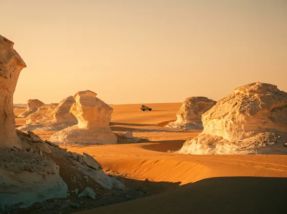 Wind-carved chalk formations in the White Desert at sunset